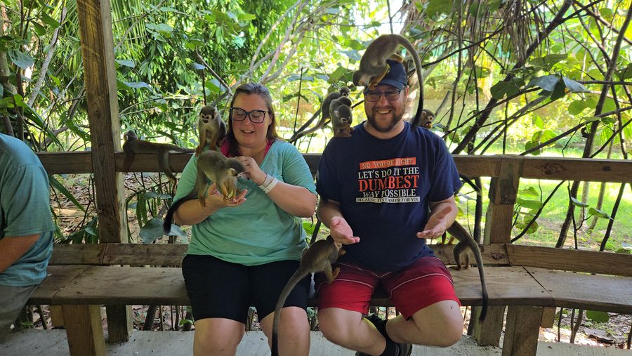 Preston and Shannon with squirrel monkeys on a tropical excursion